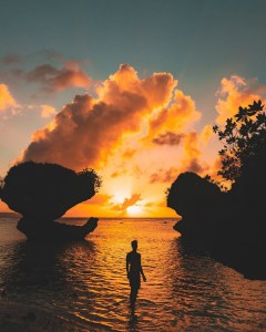 a sunset over a body of water