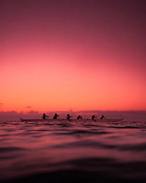 a sunset over a body of water