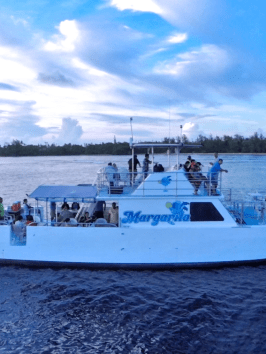 People parting and enjoying themselves on the decks of the Big Sunset Cruise in Tumon, Guam