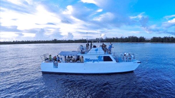 People parting and enjoying themselves on the decks of the Big Sunset Cruise in Tumon, Guam