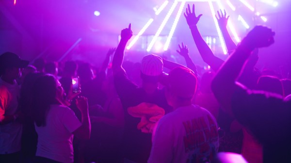 a group of people on a stage playing a video game
