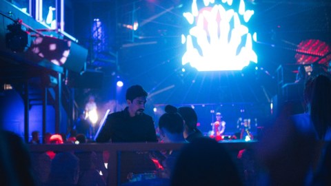 a group of people on a stage in front of a crowd