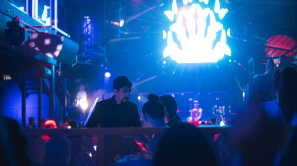 a group of people on a stage in front of a crowd