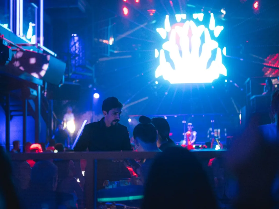a group of people on a stage in front of a crowd