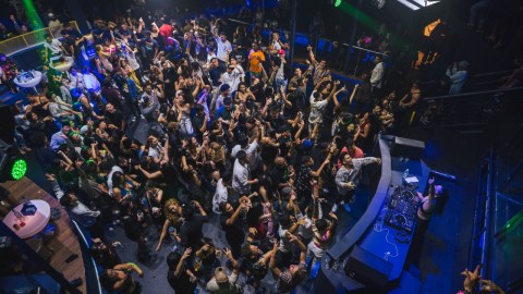 a group of people on a stage in front of a crowd