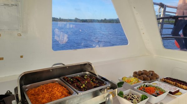 a tray of food and a glass of water