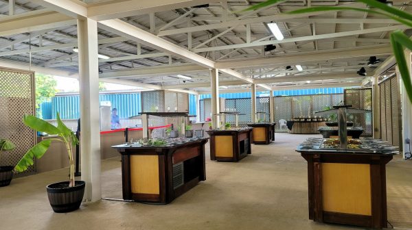 a room filled with furniture and a table in front of a building