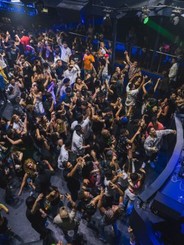a group of people on a stage in front of a crowd