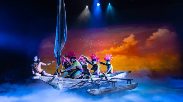 a group of people riding skis on a snowy surface