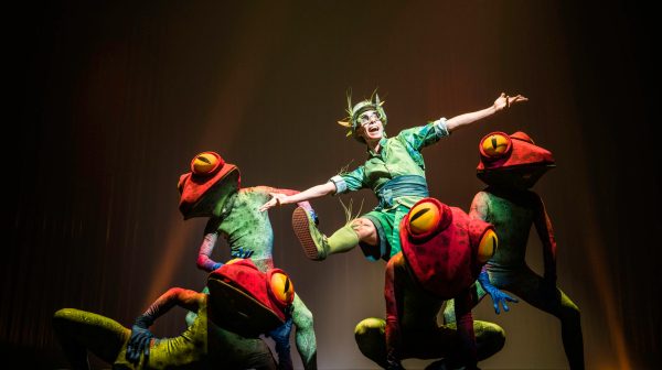 a group of people jumping in the air