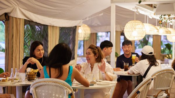 a group of people sitting at a table