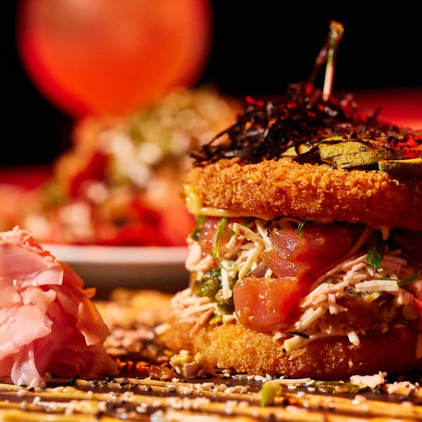 a close up of a plate of food with a slice of cake