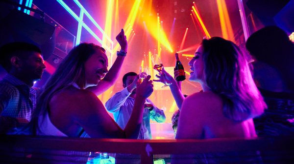 a group of people sitting in front of a stage