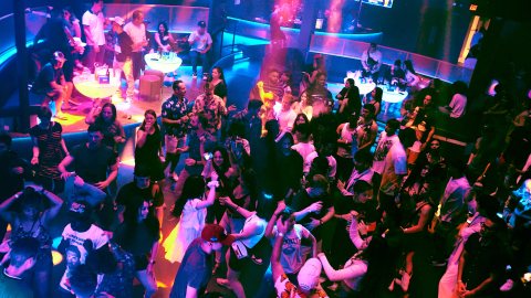 a group of people on a stage in front of a crowd