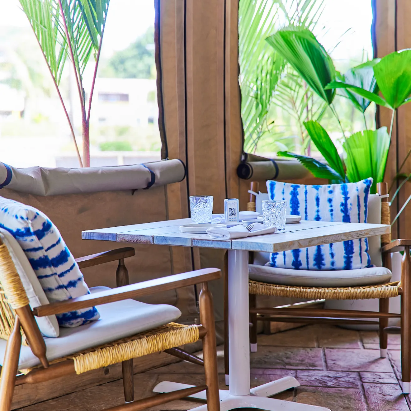 a dining room table in front of a window