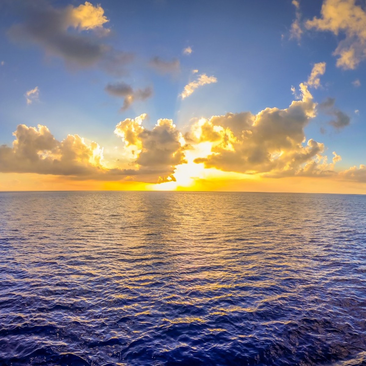 a sunset over a body of water