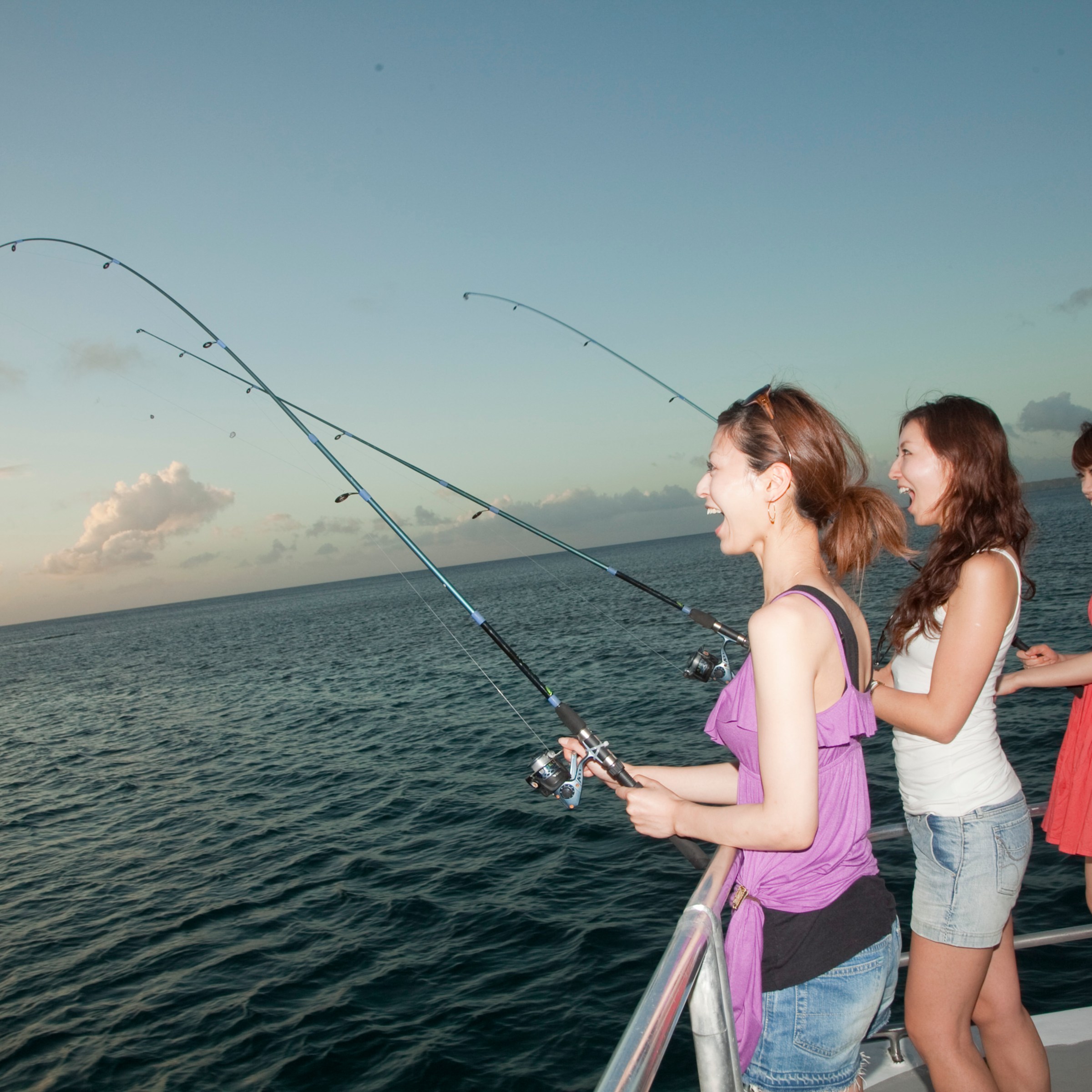 a person standing next to a body of water