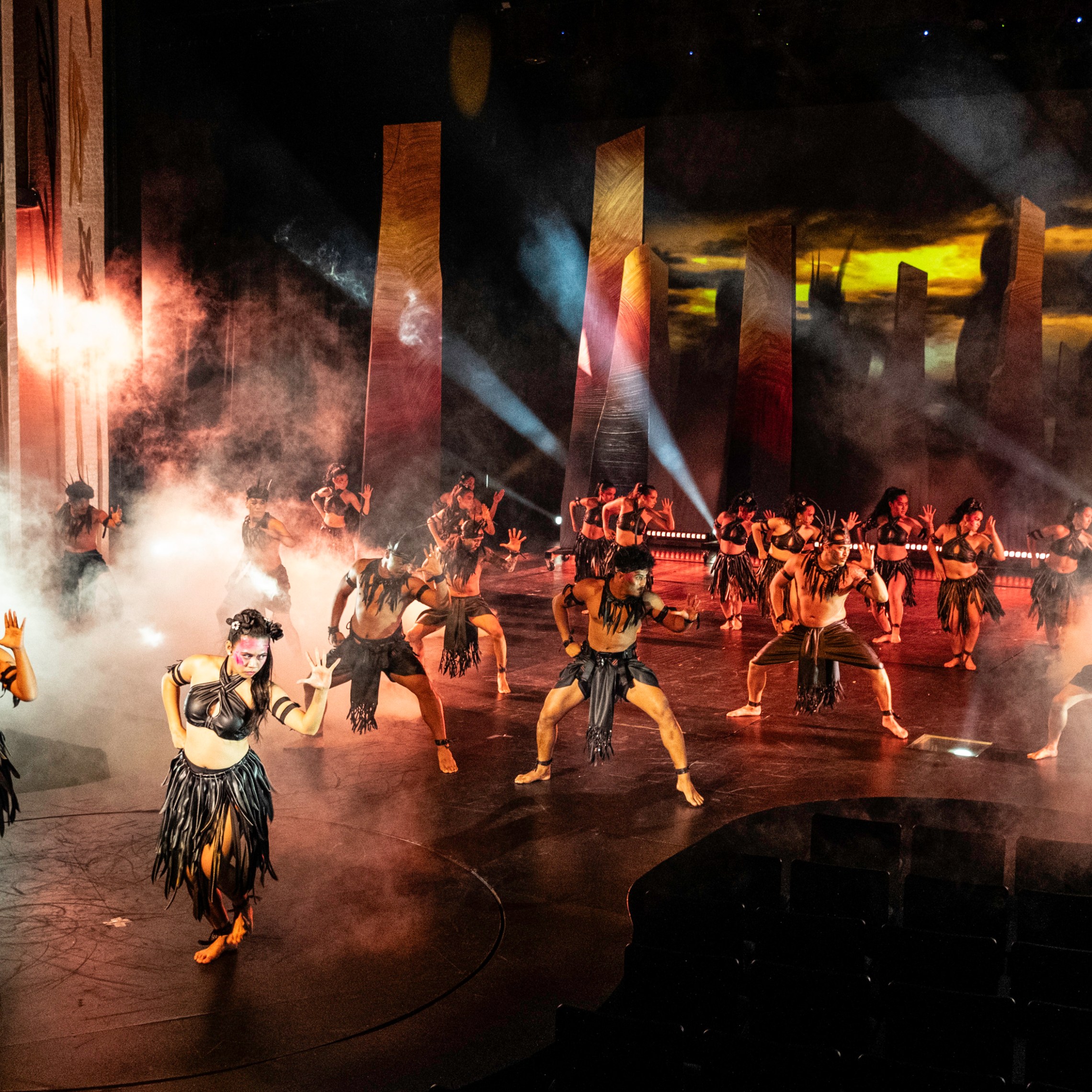 a group of people standing around a fire