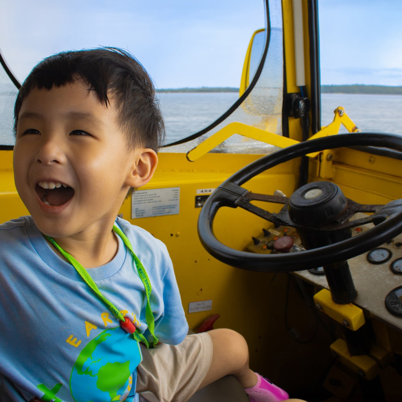 a young boy sitting on a table