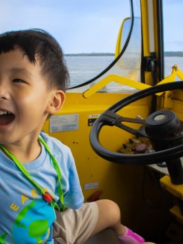 a young boy sitting on a table