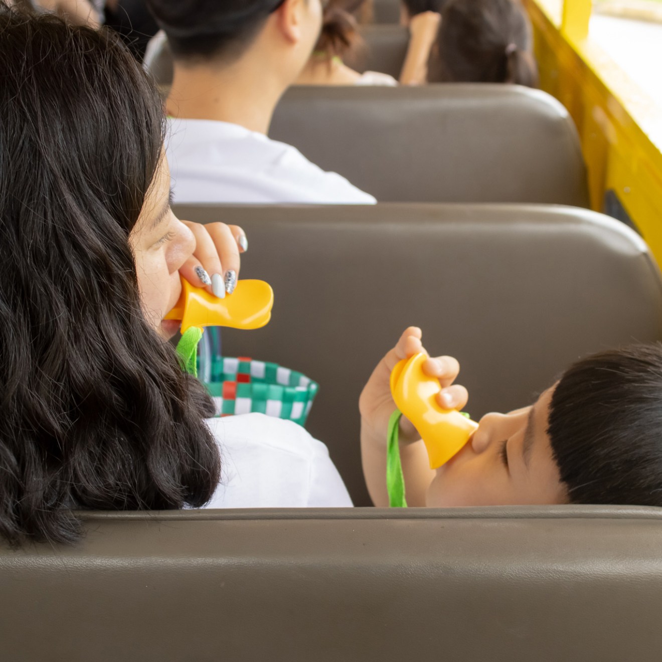 a group of people sitting around a car