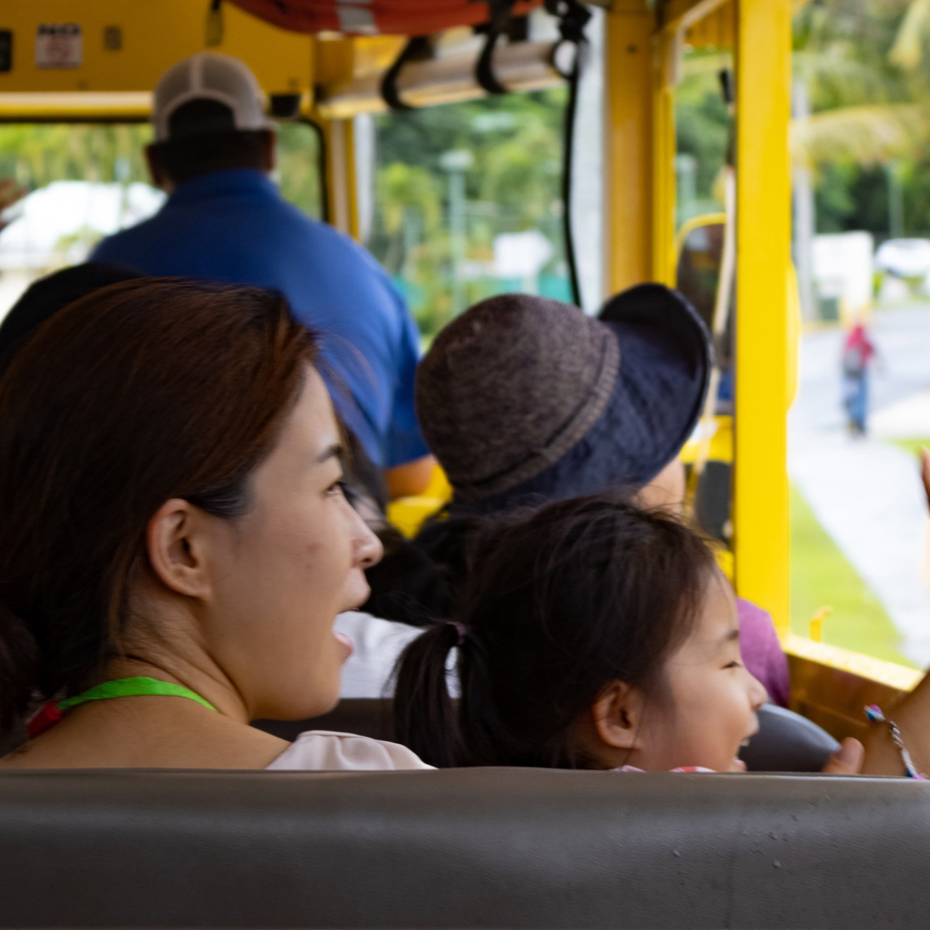 a group of people sitting on a bus