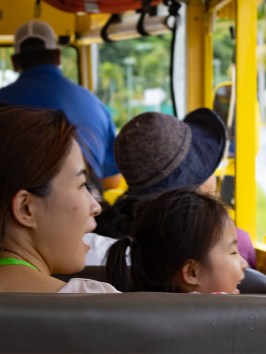 a group of people sitting on a bus