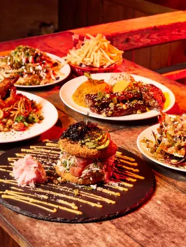 a plate of food on a wooden table