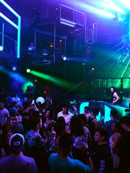 a group of people on a stage in front of a crowd