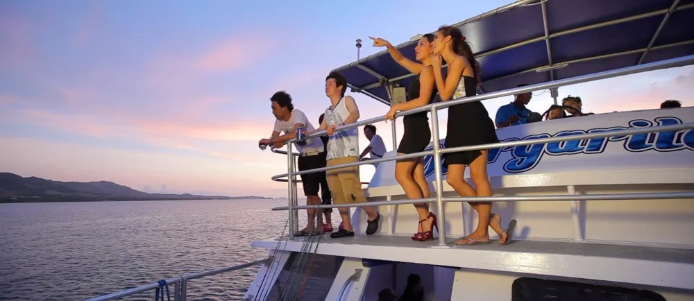 a group of people on a boat in the water