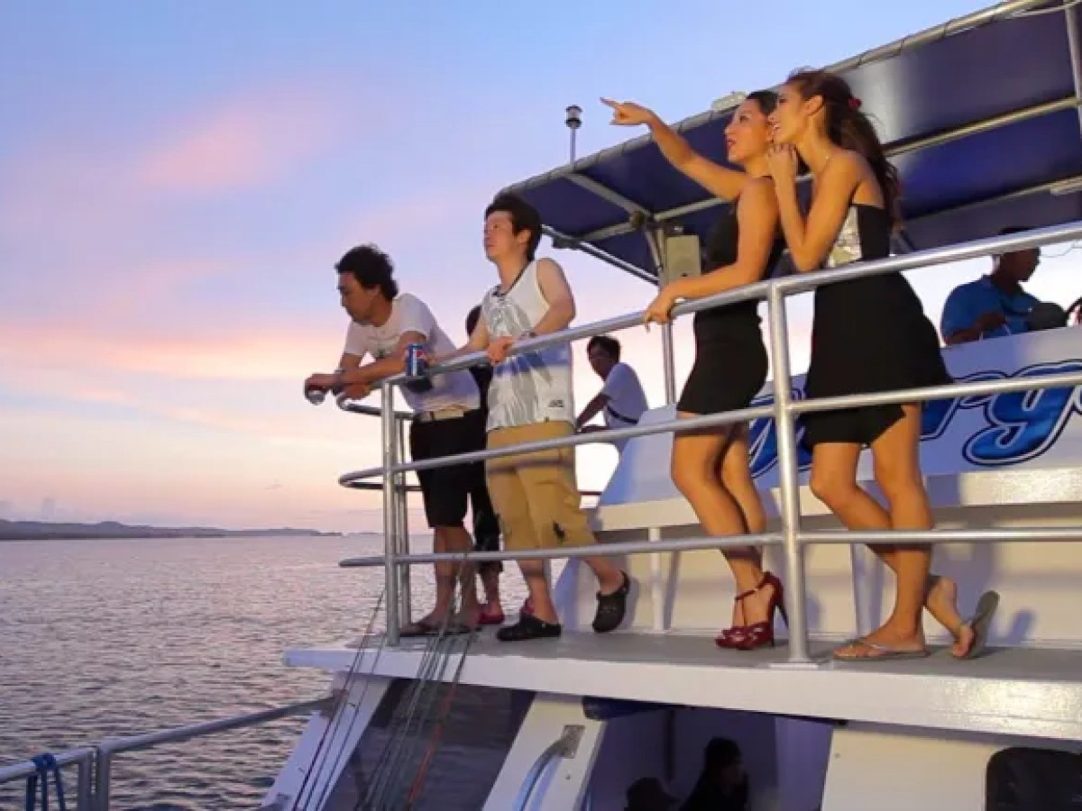 a group of people on a boat in the water