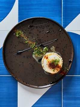 a cake sitting on top of a wooden table