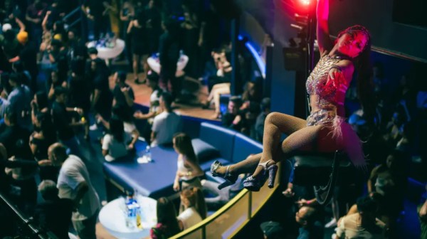 a man on a stage in front of a crowd