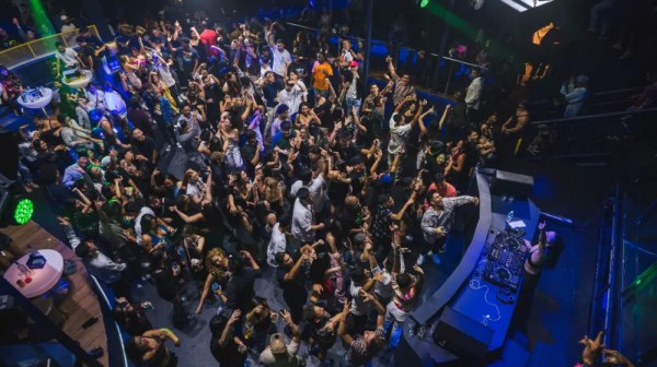 a group of people on a stage in front of a crowd