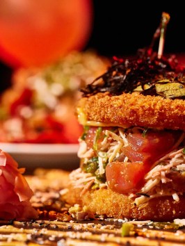a close up of a plate of food with a slice of cake