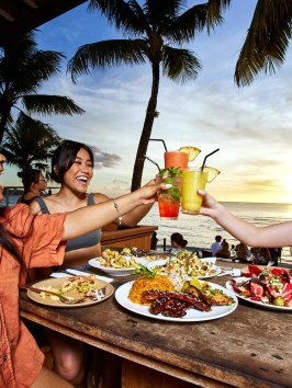 a couple of people that are eating some food