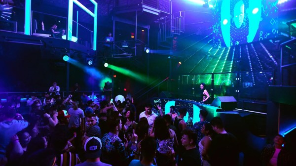 a group of people on a stage in front of a crowd