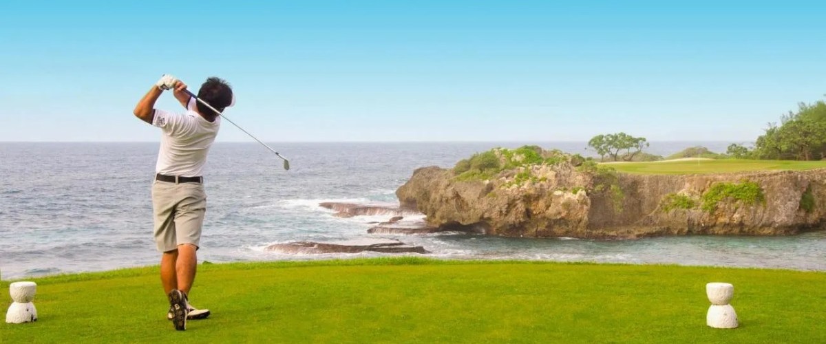 8-HERO_OOG-Golf.__72-DPI-e1730782374150 a man flying through the air over a body of water