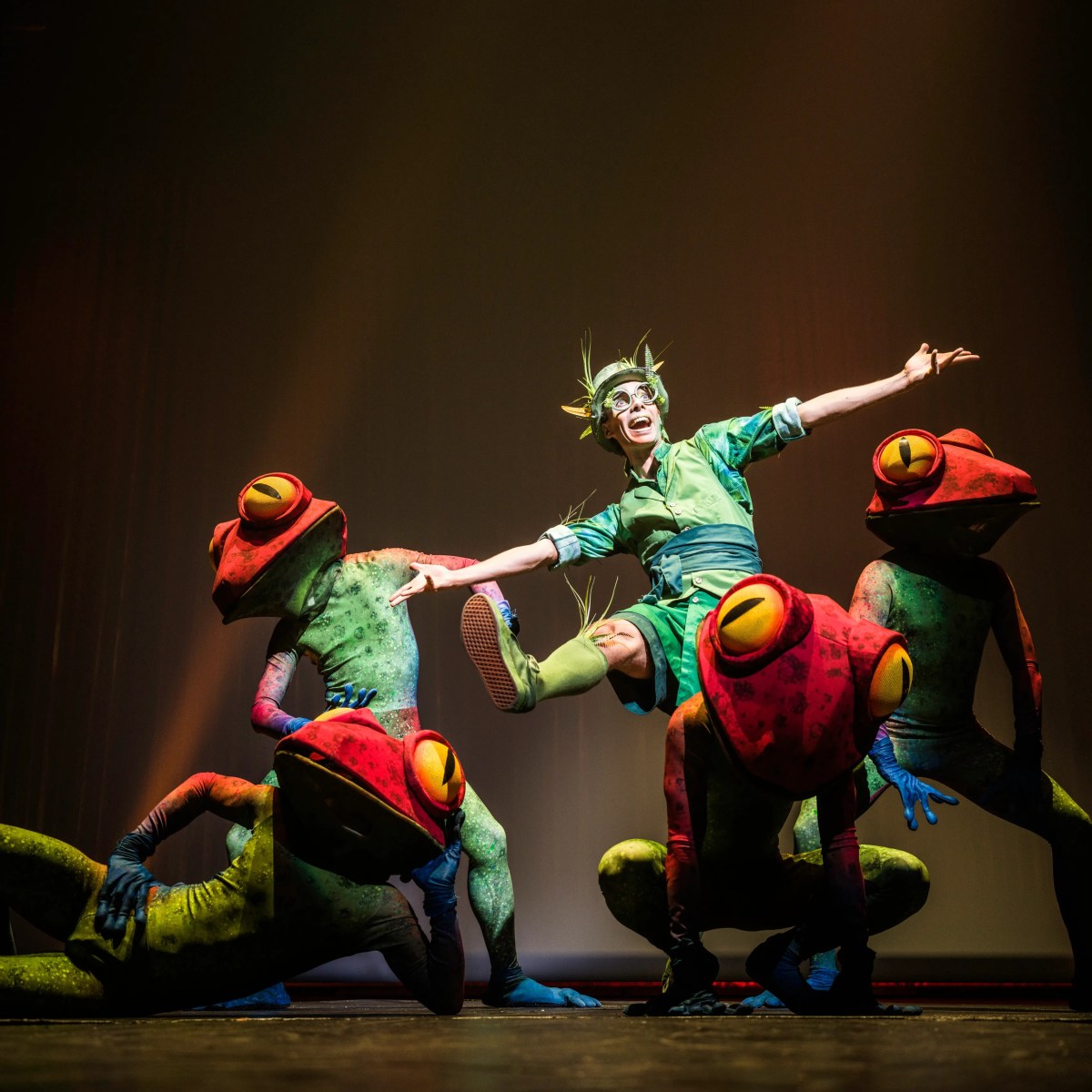 a group of people performing on a stage