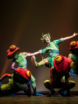 a group of people performing on a stage