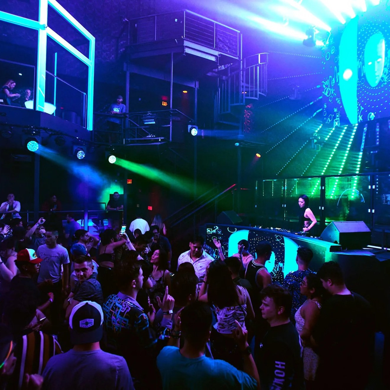 a group of people on a stage in front of a crowd