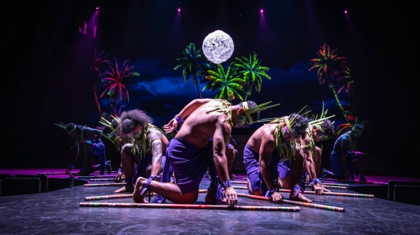 a man sitting on a stage