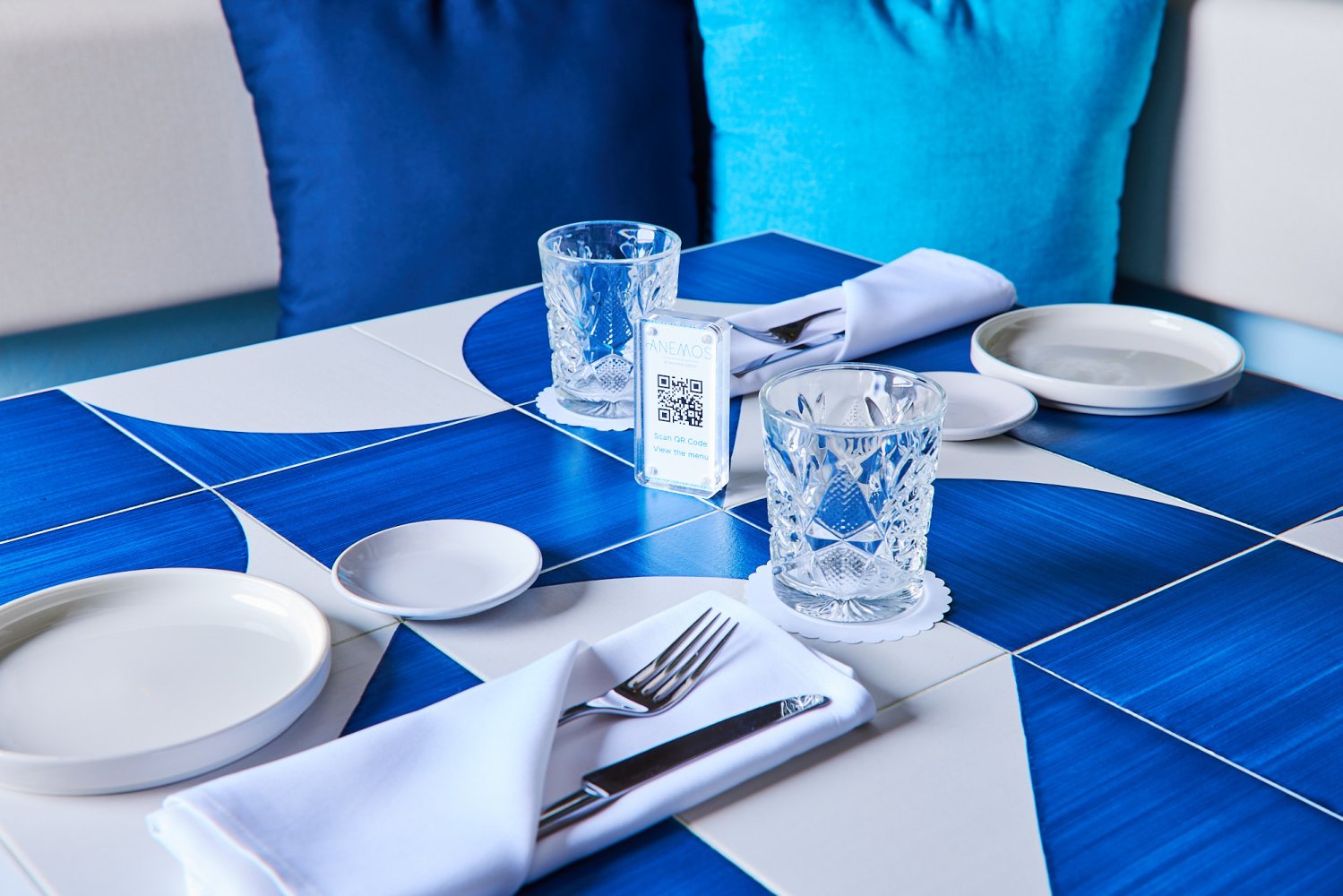 a blue and white plate sitting on a table