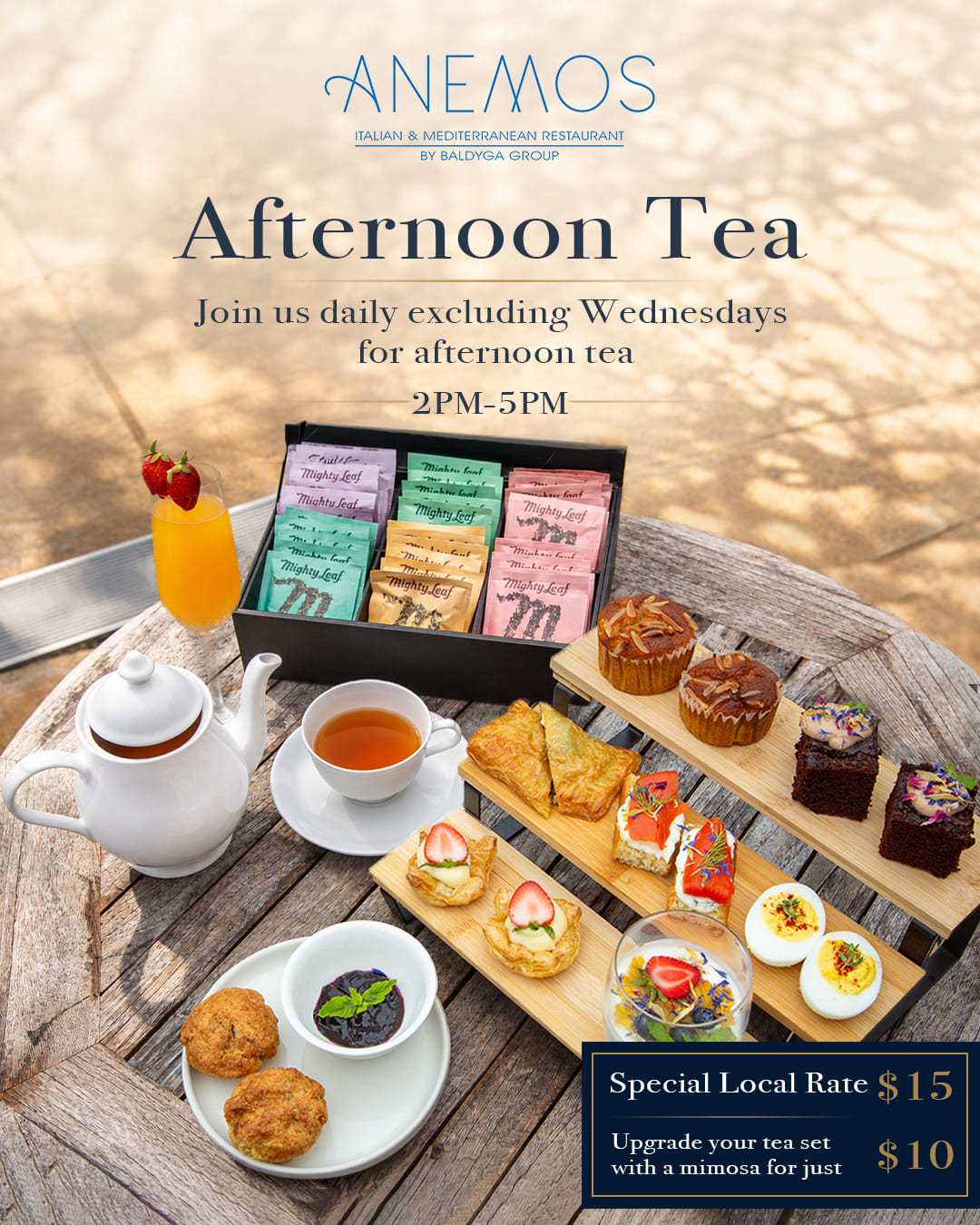 Afternoon tea set with assorted teas, pastries, and sandwiches at a restaurant.